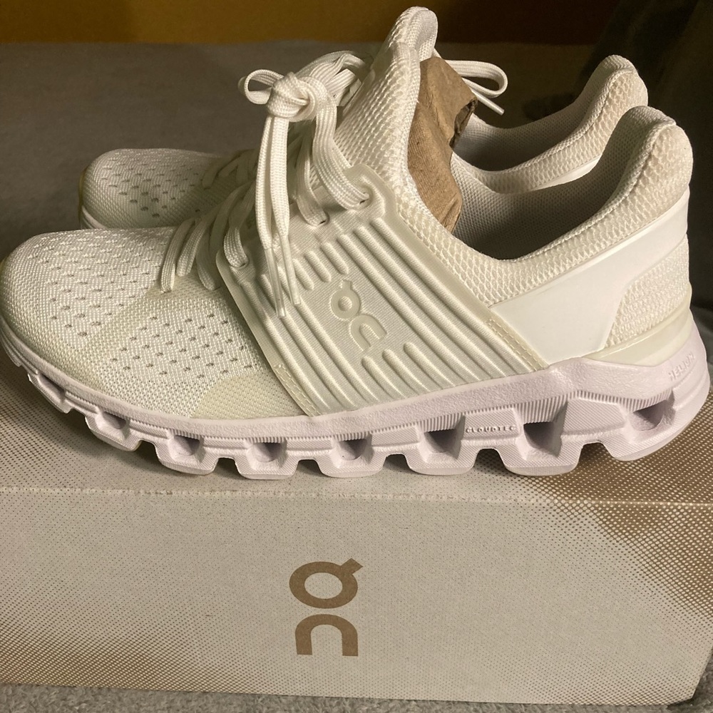 Woman’s all white Cloudswifts On running athletic shoes
